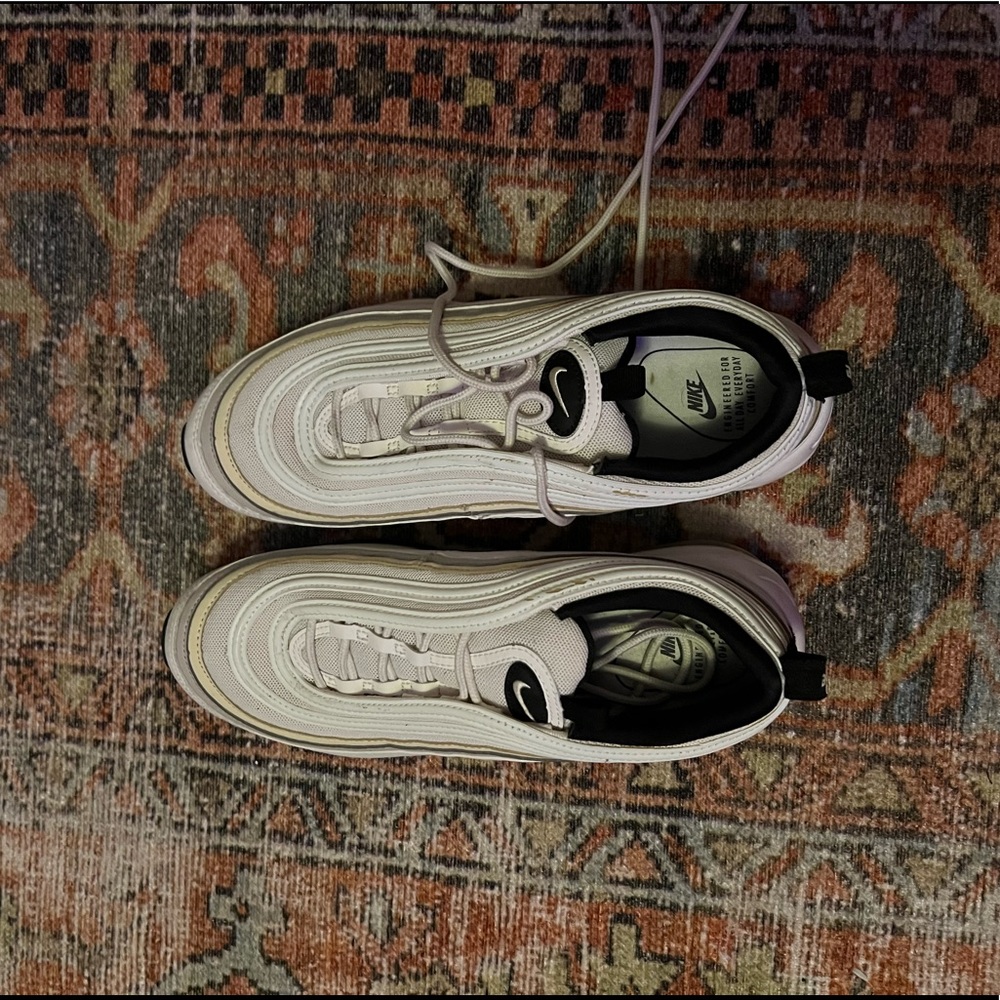 Nike Air Max 97 in cream and white.